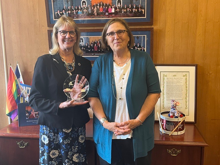 Greater Boston Food Bank President & CEO Catherine D'Amato presents the State Senate Public Advocate of the Year Award to State Sen. Joan Lovely (D-Salem).