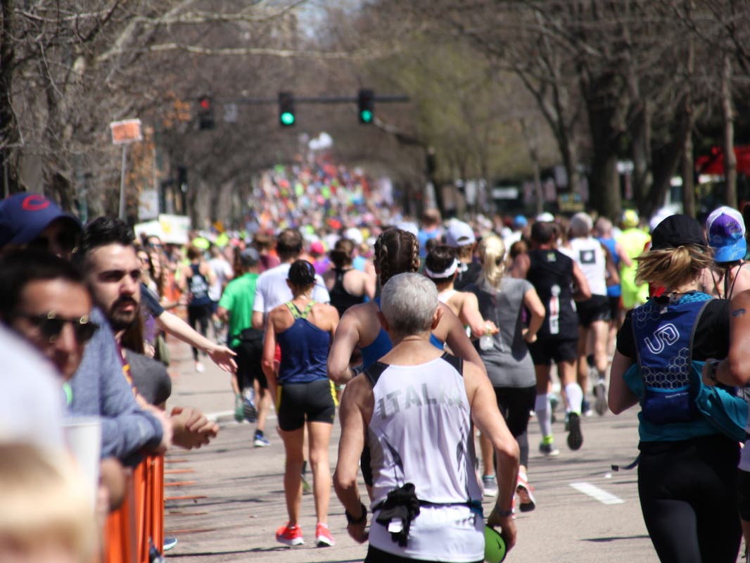 Representatives from TrailblazHers Run Co. said they were cheering on runners at Mile 21 of the race in Newton when police set up restraint lines in front of them that targeted members because of their race.