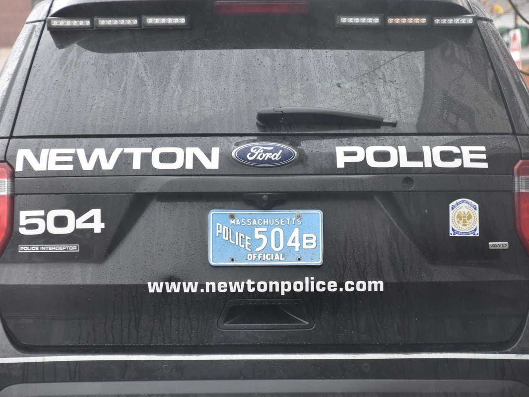 Newton police said on Tuesday afternoon they were called to the Nahanton Street property for a report of the man tearing the blue ribbons down from trees lining the property. 