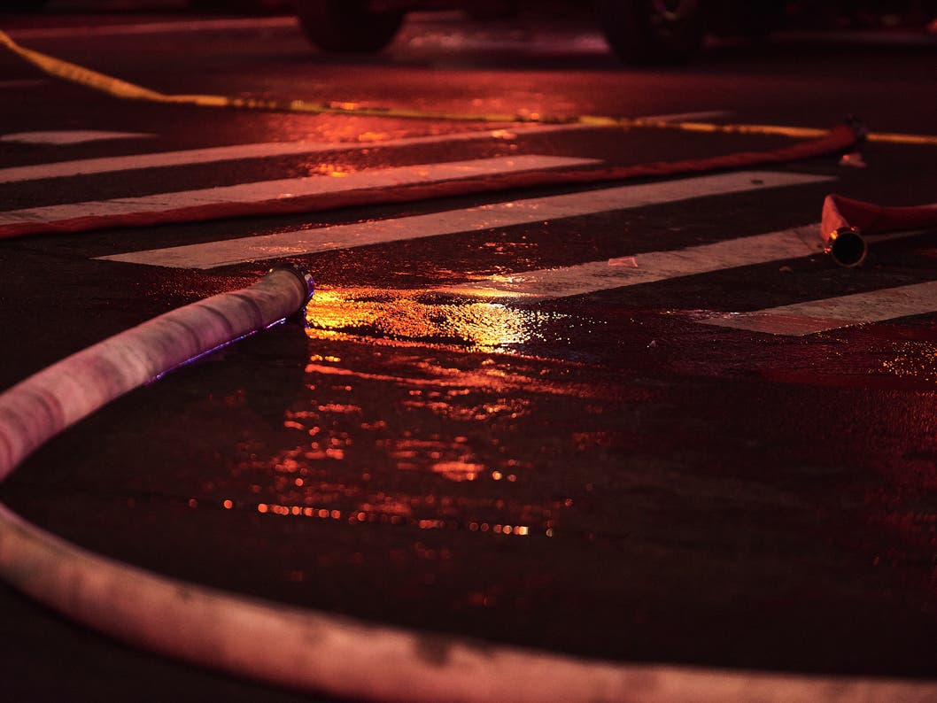 A smoky fire that raged through the yard of a trucking company in Peabody reached two alarms Tuesday before crews got the blaze under control.