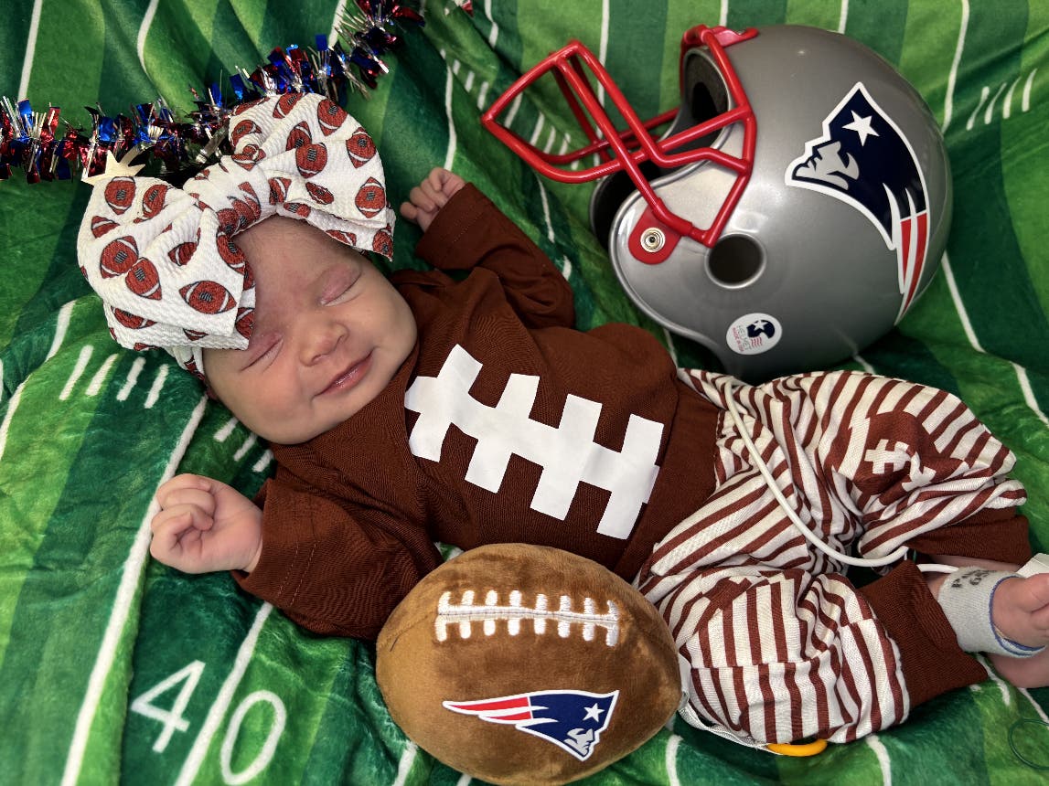 Staff and families of the newborns geared them up in style to show their support for Drake Maye and company as they prepared to take on the Seattle Seahawks in Santa Clara, California.