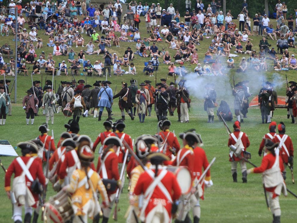 The militia exchanged volleys of gunfire with British troops during the land battle.