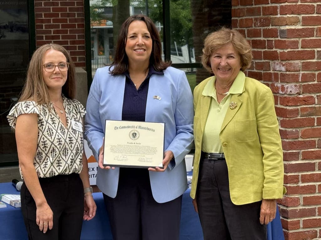 Lt. Gov. Kim Driscoll, center, presents a citation from Gov. Maura Healey to Essex National Heritage Area. From left, Cheri Grishin, Director of Operations, Lt. Gov. Driscoll, CEO Annie Harris.