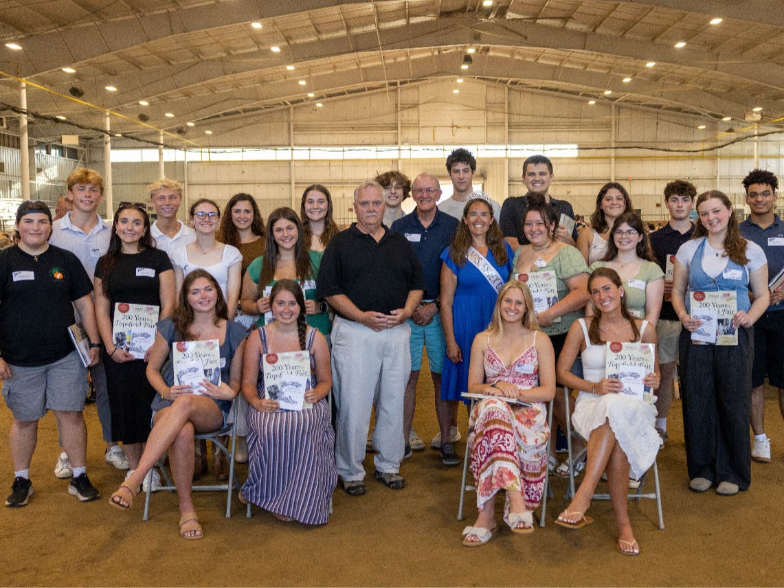 Twenty-one of the 36 recipients of scholarships from the Topsfield Fair gather at the Fair's annual Volunteer Picnic in August.