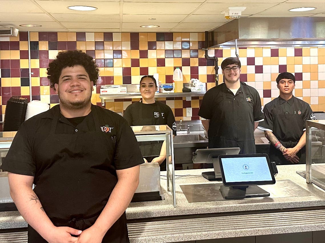 Root graduates: Danny Montezuma, Nevaeh Isales, and Nick Carpenter along with Rondner Reyes in the NSCC kitchen.