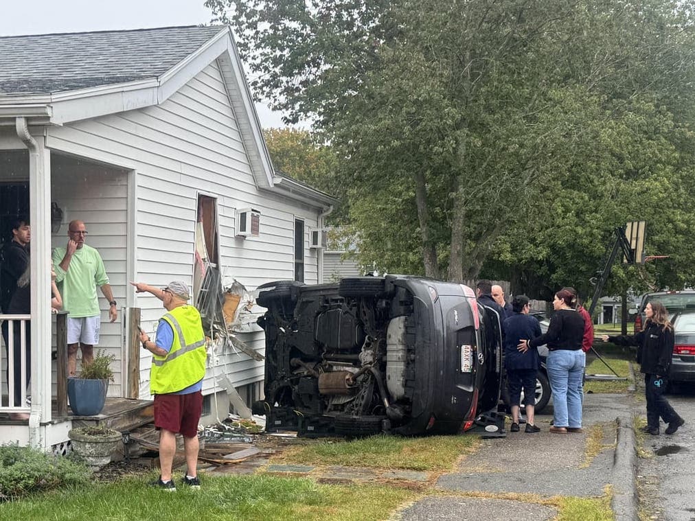 Beverly police and fire responded to the crash on Thompson Road at about 9:45 and found the SUV on its side with damage to the outside of the house.