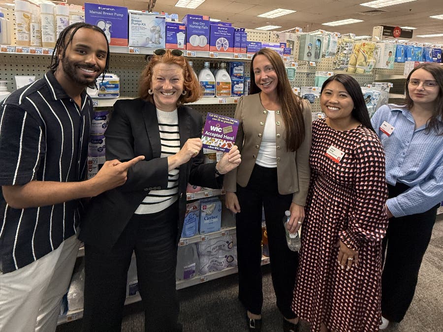 State Rep. Jenny Armini and CVS staff commemorate the store's enrollment in the WIC program for purchase of infant formula.
