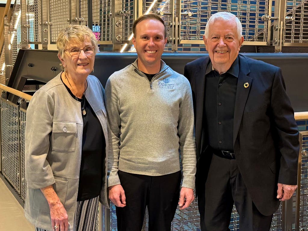 Dr. Bryan Cain (center) with Joyce and Bill Cummings at Wednesday's Annual Trustee Meeting, held at Franklin Cummings Tech, in Nubian Square