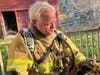 A weary Woodbury Fire Capt Steve Cunningham unhooks 60 lbs of gear at end of March 28th drill.