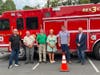 Woodbury's new Rescue 3 firetruck is shown and dedicated to Fire Chief Janet Morgan at the annual awards dinner June 25th, 2026. From left, Deputy Chief Dave Lampart, Firefighters Don Harris, Rob Start, Chief Morgan, Scott Dayton, Corey Shaker .