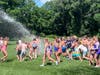 Woodbury firefighters spray kids from Engine 8 turret gun marking end of summer camp July 31st.