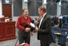 Superintendent Al Williams, Jr. is honored by Forsyth County Manager Eric Johnson.