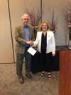 Cherokee County Historical Society Director Stefanie Joyner honors Lou Karably as the volunteer of the year.