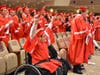 Elijah Cook did not let being in a wheelchair stop him from walking at the Cherokee High School graduation.