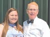 Superintendent of Schools Brian Hightower congratulates scholarship winner, Morgan Reeg, of Woodstock High School.