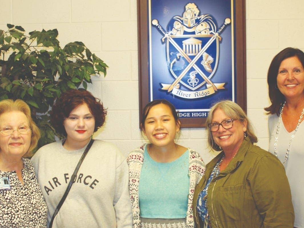 Alicia Mazzurra, second from left, is congratulated for getting an honorable mention in the Georgia Farm Bureau contest.