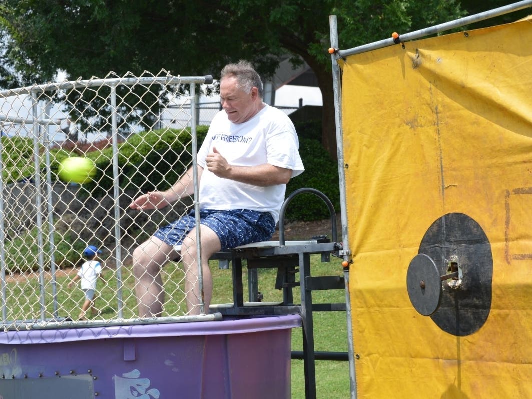 Forsyth County Commissioner Dennis Brown waits to get dunked during this event last year. 