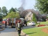 Cherokee County firefighters arrived on the scene within minutes to find black smoke coming from the garage.