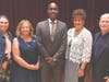 Keynote speaker Dr. Tyrone Howard is thanked by school board members.
