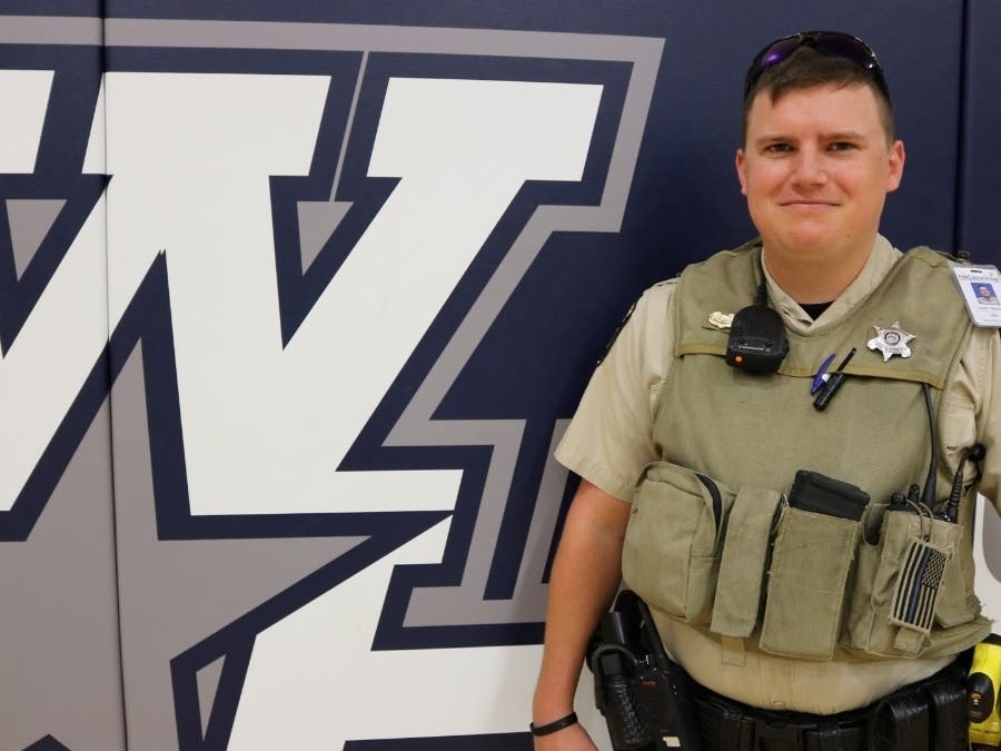 Deputy Zack Marley routinely sits with students during lunch at West Hall High School.