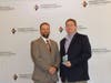 Neil Blackman (l), Corblu Ecology Group and 2019 Chair of Leadership Cherokee, congratulates Jason Blakey (r) with Credit Union of Georgia on being named the recipient of the Bob Frongillo “Magic Spark Plug” Award.