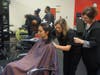 Chattahoochee Tech Cosmetology student Maci Holcomb is cutting hair for her first client ever, Rebecca Cardoso, at the Cosmetology program's salon on the North Metro Campus. Shown, l-r, are Cardoso, Holcomb and Instructor Colette Arp.