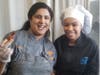 Riverwood International Charter School Culinary Arts student Madison Langton (R) makes wing magic with Chef Archna Becker of Bhojanic Atlanta. 