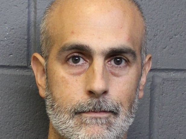 Gene Steven Barbara, 41, from Alpharetta, was charged with possession of firearms in a school zone.