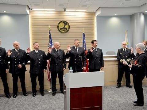 Twenty-four members of the Johns Creek Fire Department were sworn-in after being promoted to various positions within the department.