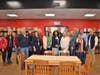 More than two dozen community partners and volunteers came to celebrate the ribbon cutting for the new food pantry.