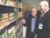 Superintendent of Schools Dr. Brian V. Hightower, left, and Cherokee HS Principal Todd Miller tour the food pantry, which will serve the school’s families in need.