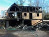 Cherokee County 911 received a call stating that flames were showing and half of the house was on fire.