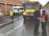 School Police Chief Buster Cushing speaks with Officer Beth Jeffreys about evacuation procedures during the multi-agency emergency response drill on Thursday at Cherokee High School.