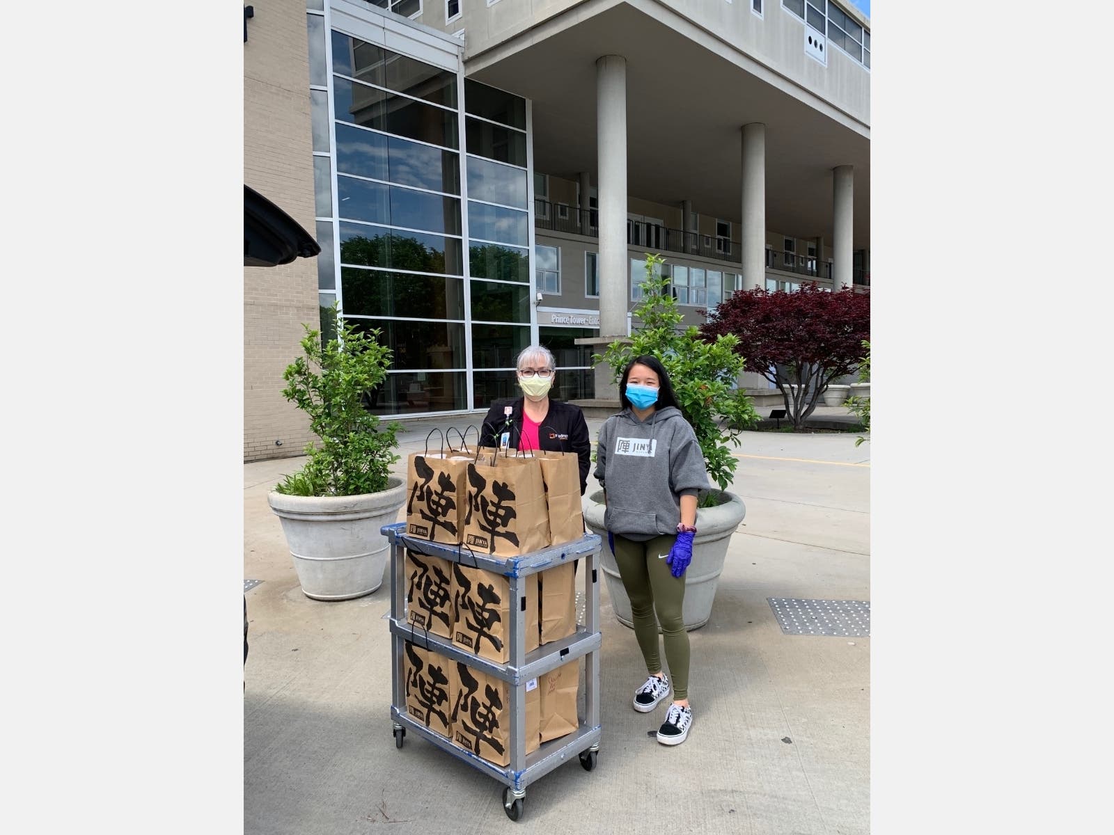 Riverwood International Charter School IB student Ashley Wang delivers meals to frontline hospital employees as part of the Food for the Frontlines project that she and fellow classmates founded.