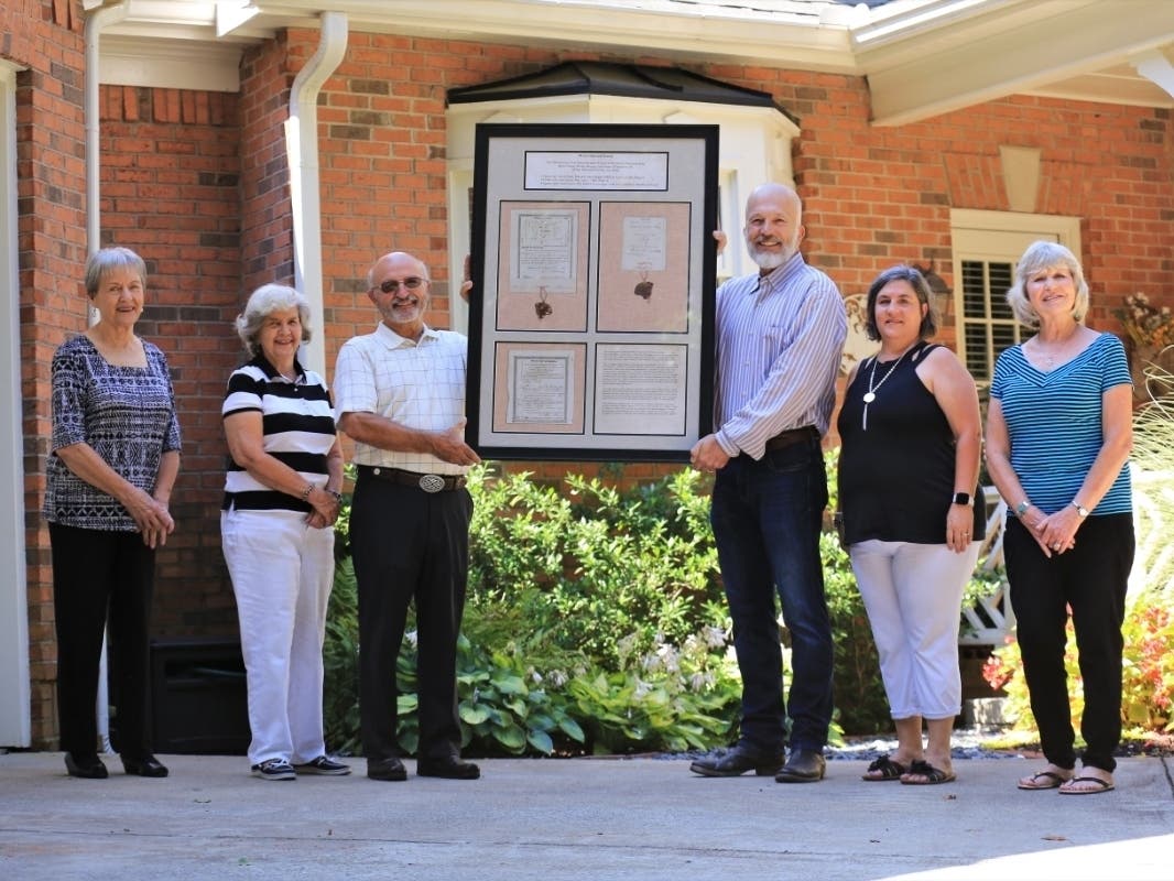 Members of the Foster/Morgan/Gilleland families gather at the donation ceremony of a long-lost collection of historic documents given to the Milton Historical Society.