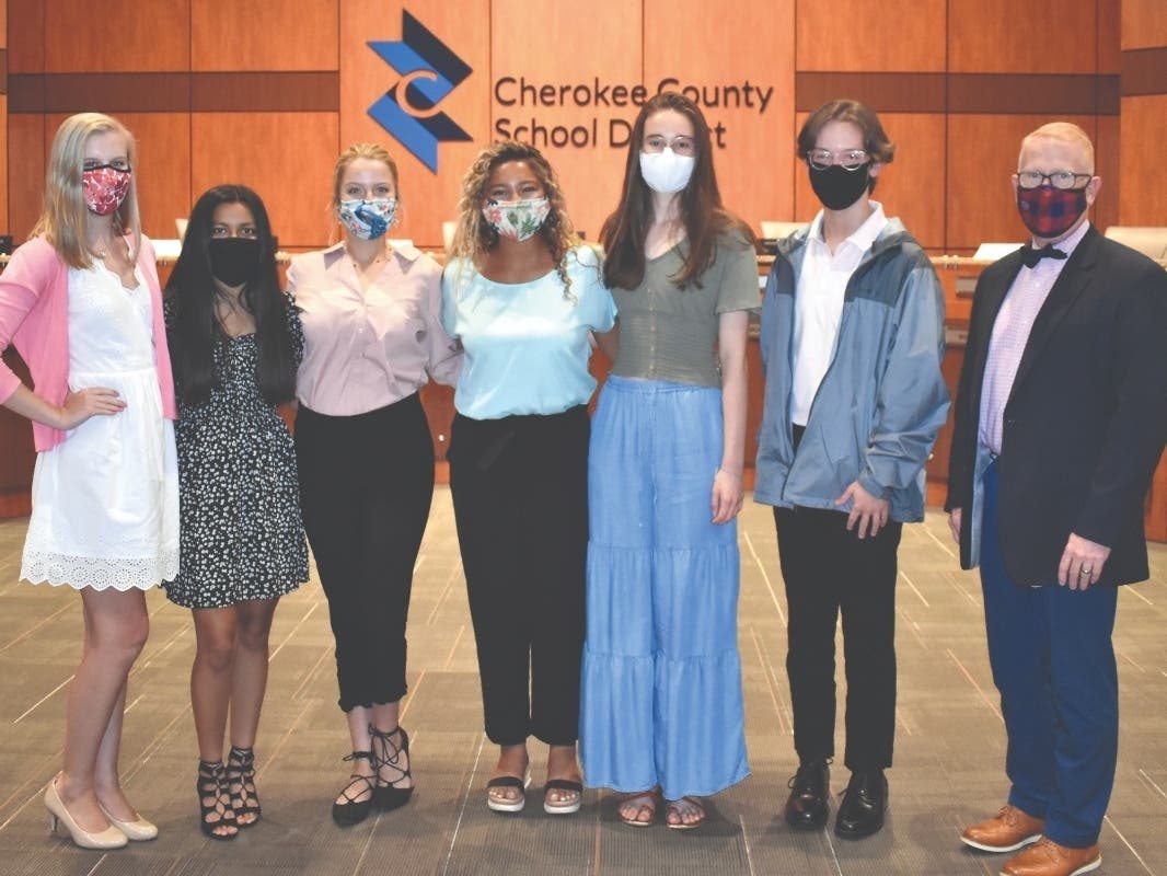 Superintendent Brian Hightower congratulates the 2020-21 student delegates to the school board.