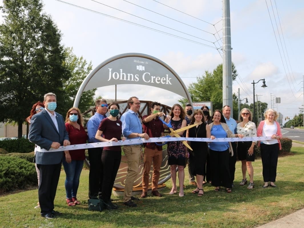 The bridge on the Marker is leading you from Johns Creek's past into its future, whose history flows like the Chattahoochee River.