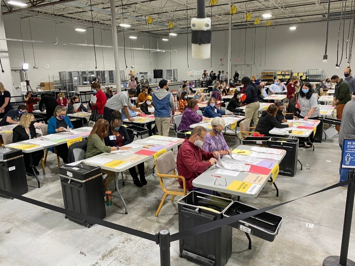 Volunteers begin the re-tally of votes in Georgia on Friday morning in Gwinnett County.
