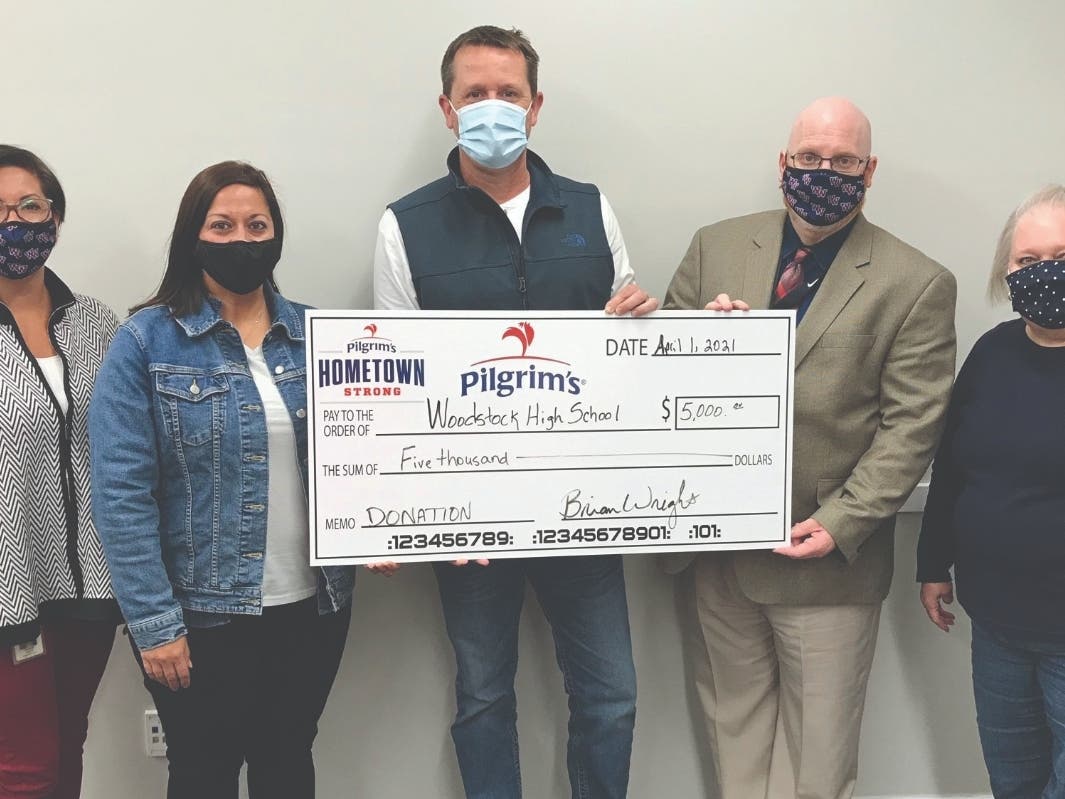 From left to right, Assistant Principal Meagan Waid, teacher and FCCLA advisor Adrienne Fagan, Pilgrim’s line production manager Matt Chastain, Principal Mark Smith and Martha Covington, administrative assistant with Pilgrim’s.