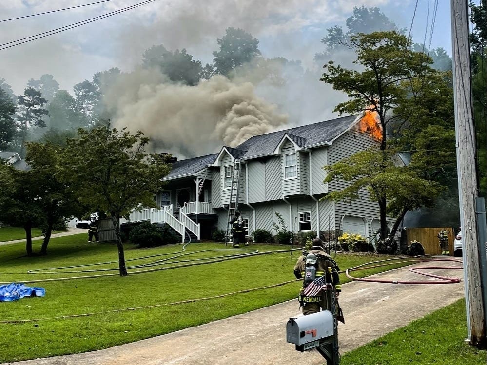 Three adults and a child escaped without any injuries after their house on Scarlett Lane near Woodstock caught fire.