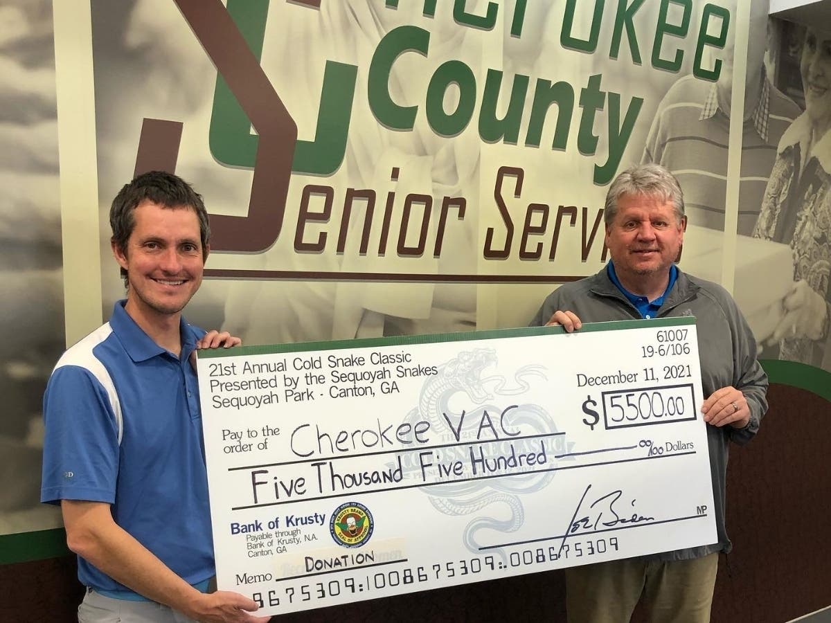 From left, Tournament Director Mark Sheldon and Cherokee Senior Services Director Tim Morris.