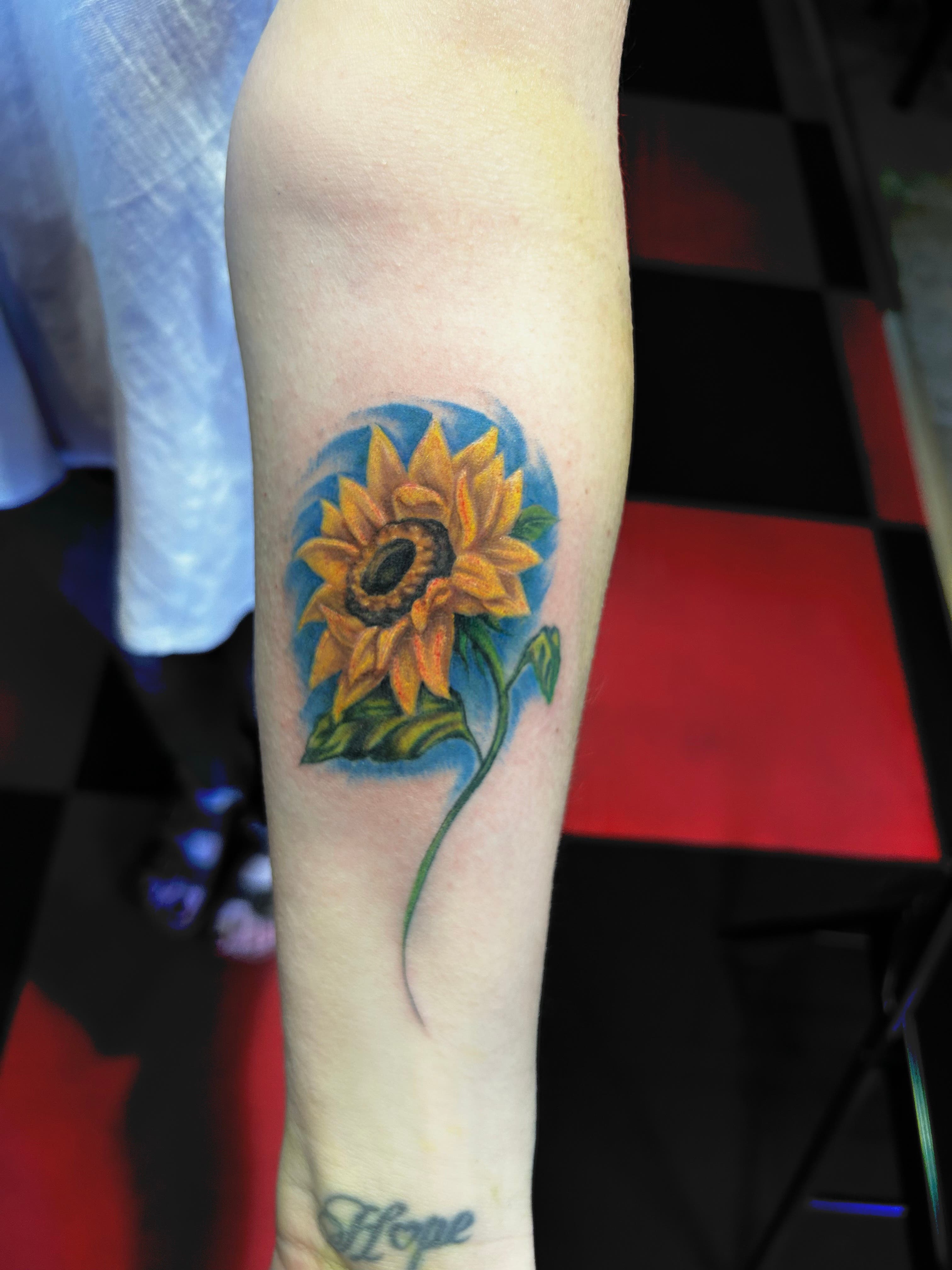 Sunflower tattoo by George at Mayhem Ink Tattoo in Nashua! Open for walk ins!