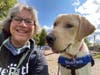 Puppy raiser Anne Garretson with future service dog Radio at BluePath Service Dog’s fourth annual walkathon.