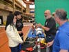 From left, Karina Arreola with her son Bruno Flores, 16, a junior at Ossining High School, chat with Gene Barbieri and John Malaspina of Sheet Metal Workers L.U. 38 about career opportunities in the building trades.  
