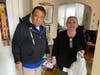 Doorstop deliveries to low-income neighbors care of ICNA Relief team members.
