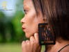 Kemone Hendricks models the Black Lives Matter earrings she's selling to help ensure funding for future parades.