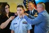 Caleb's parents, Jason & Melissa Eyler, assist with "pinning" on his new rank/grade of Cadet Second Lieutenant.
