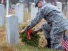 Cadet Technical Sergeant Michael Bestall lays wreath for fallen soldier  