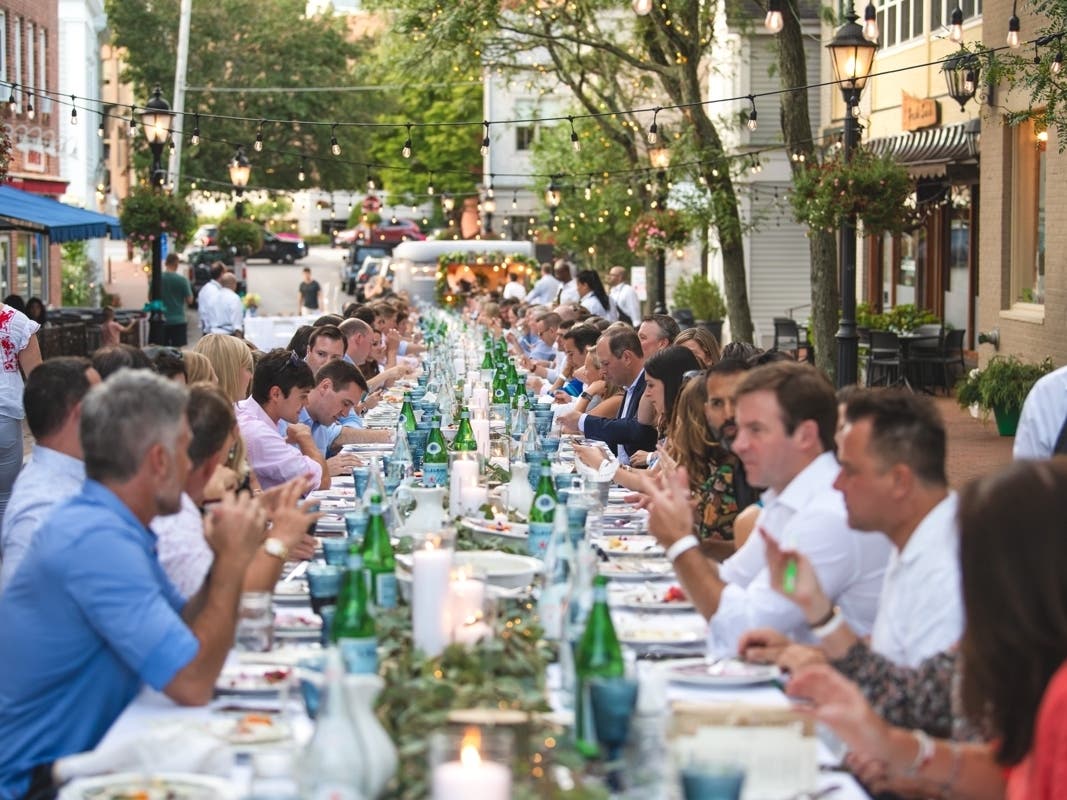 Diners enjoying dinner under the stars at the YWL's 1st Annual Dinner Downtown.