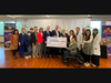 The joyful photo taken during the Million-Dollar Check Presentation Ceremony held at the CCACC Art Gallery, Gaithersburg, Maryland.